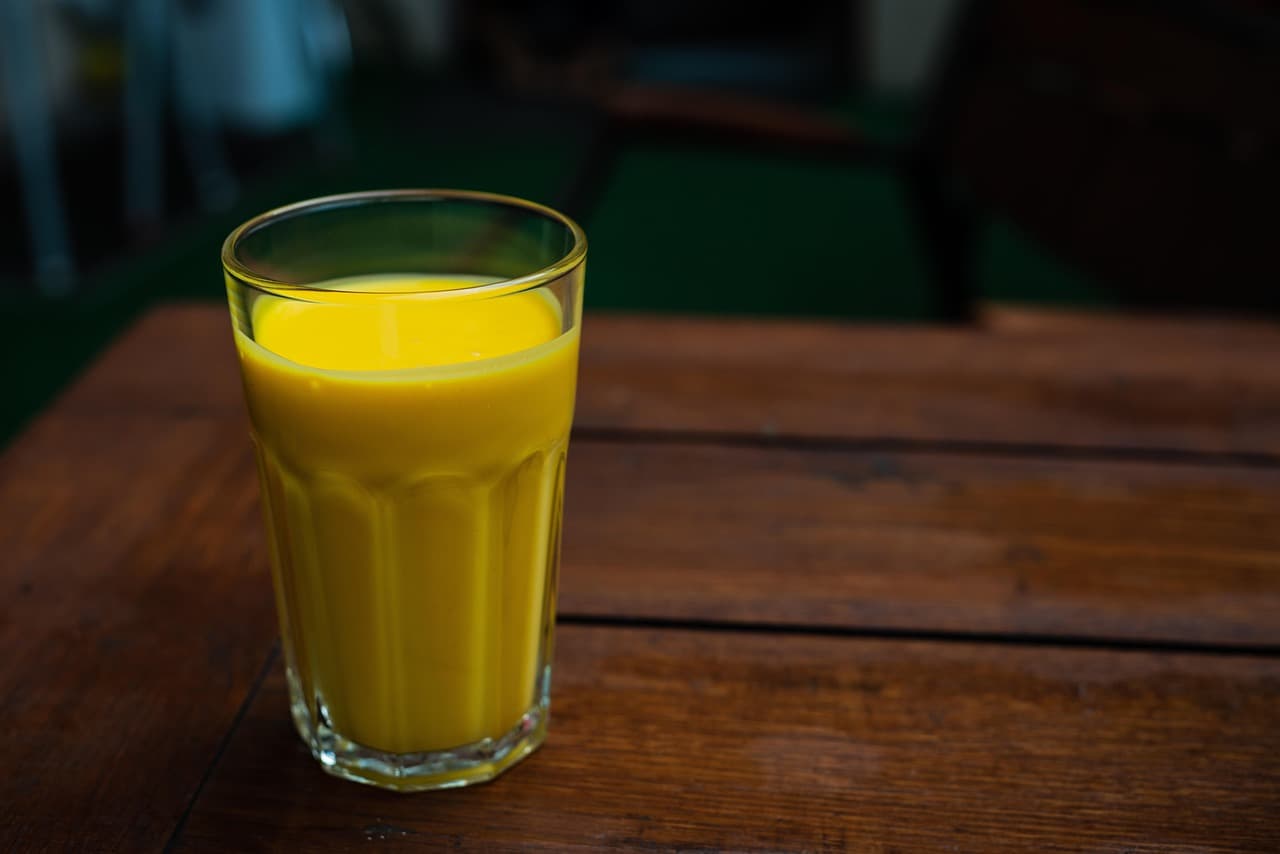 A tall glass of mango lassi